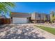 Charming home featuring a spacious driveway, desert landscaping, and a two-car garage at 8307 E Buena Terra Way, Scottsdale, AZ 85250