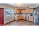 Bright kitchen featuring wood cabinets, stainless steel appliances, and luxury vinyl plank flooring at 8307 E Buena Terra Way, Scottsdale, AZ 85250