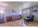 Cozy living room featuring hardwood floors, ample seating, and a bright window at 8307 E Buena Terra Way, Scottsdale, AZ 85250