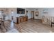 Spacious living area with wood floors, media center, staircase and easy access to the kitchen at 8307 E Buena Terra Way, Scottsdale, AZ 85250