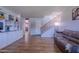 Spacious living room features hardwood floors, custom built-ins, and easy access to the staircase at 8307 E Buena Terra Way, Scottsdale, AZ 85250