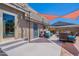Outdoor patio featuring a covered lounge area with comfortable seating and a door to pool at 8307 E Buena Terra Way, Scottsdale, AZ 85250