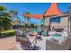 Inviting backyard patio with stylish seating, barbecue grill, and refreshing pool access, perfect for outdoor relaxation and entertaining at 8307 E Buena Terra Way, Scottsdale, AZ 85250