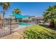 Backyard pool with lush landscaping, inviting outdoor space, and secure fencing, creating a private oasis for leisure at 8307 E Buena Terra Way, Scottsdale, AZ 85250