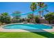 Backyard pool with hot tub, grassy area, shade sails, and desert landscaping, perfect for relaxation and entertaining at 8307 E Buena Terra Way, Scottsdale, AZ 85250