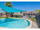 Backyard pool with sunshade and step entry, creating a delightful aquatic retreat in a private outdoor setting at 8307 E Buena Terra Way, Scottsdale, AZ 85250
