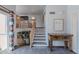 Staircase with a view of a living space below and a small wooden accent table at 8307 E Buena Terra Way, Scottsdale, AZ 85250