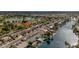 An aerial view of a community with waterfront homes, showcasing lush greenery and serene lake views at 835 W Beechnut Dr, Chandler, AZ 85248