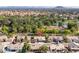 Desirable neighborhood with lush trees, community lakes, and serene surroundings, complemented by mountain views in the distance at 835 W Beechnut Dr, Chandler, AZ 85248