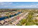 Spacious neighborhood with waterfront properties, pools, and mature trees from an elevated aerial perspective at 835 W Beechnut Dr, Chandler, AZ 85248