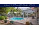 Beautiful backyard pool surrounded by mature landscaping, a covered patio and rock accents for ultimate outdoor living at 835 W Beechnut Dr, Chandler, AZ 85248