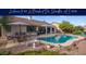 Relaxing backyard featuring a refreshing pool, covered patio, and outdoor dining area, perfect for entertaining guests at 835 W Beechnut Dr, Chandler, AZ 85248