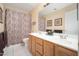 Bathroom showcasing a double sink vanity, a decorative shower curtain, and neutral walls at 835 W Beechnut Dr, Chandler, AZ 85248