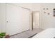 Bedroom featuring a closet with sliding doors and bright, neutral walls and flooring at 835 W Beechnut Dr, Chandler, AZ 85248