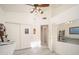 Bright room featuring a ceiling fan, storage, and a doorway leading to another room at 835 W Beechnut Dr, Chandler, AZ 85248