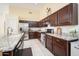 Bright kitchen with stainless steel appliances, granite countertops, and modern fixtures at 835 W Beechnut Dr, Chandler, AZ 85248
