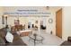 Open floor plan featuring living, dining area with light wood floors and a brown leather couch at 835 W Beechnut Dr, Chandler, AZ 85248