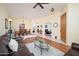 Cozy living room featuring hardwood floors, a comfortable leather sofa, and an inviting open layout for relaxation and gatherings at 835 W Beechnut Dr, Chandler, AZ 85248