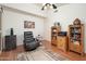 Cozy living room with wood floors, comfortable chair, and decorative built in shelving at 835 W Beechnut Dr, Chandler, AZ 85248