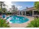 Backyard pool surrounded by desert landscaping and a covered patio at 835 W Beechnut Dr, Chandler, AZ 85248