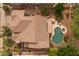 A bird's eye view of the home and backyard, including the pool, patio, and mature landscaping at 9708 E Pampa Ave, Mesa, AZ 85212