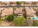 Aerial view of the property with backyard pool, patio, and well-manicured landscaping at 9708 E Pampa Ave, Mesa, AZ 85212