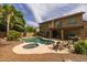 Backyard featuring a pool, spa, waterfall and an outdoor patio area at 9708 E Pampa Ave, Mesa, AZ 85212