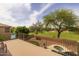 Outdoor living space with wrought iron fencing, a hot tub and views of the golf course at 9708 E Pampa Ave, Mesa, AZ 85212