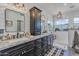 The bathroom features a double sink vanity, shiplap walls, and a glass-enclosed shower at 9708 E Pampa Ave, Mesa, AZ 85212