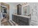 Charming bathroom featuring a double sink vanity, shiplap walls, and a barn door closet at 9708 E Pampa Ave, Mesa, AZ 85212