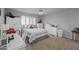 Bright bedroom with a ceiling fan, white furniture and natural light from the window at 9708 E Pampa Ave, Mesa, AZ 85212