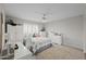 Bright bedroom with white furniture, ceiling fan and great natural light at 9708 E Pampa Ave, Mesa, AZ 85212