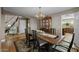 Formal dining area with neutral colors, wooden table and stairs at 9708 E Pampa Ave, Mesa, AZ 85212