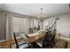 Dining room with a chandelier and view into the staircase at 9708 E Pampa Ave, Mesa, AZ 85212