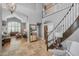 Spacious entryway with tile flooring, staircase, and open access to the living room showcasing the home's layout at 9708 E Pampa Ave, Mesa, AZ 85212