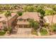 Two-story home featuring a tile roof, a manicured lawn, desert landscaping, and a two-car garage at 9708 E Pampa Ave, Mesa, AZ 85212