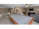Open game room features a pool table, TV, comfortable seating, and entertainment options at 9708 E Pampa Ave, Mesa, AZ 85212