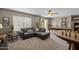 Cozy game room with a pool table, chess table, and leather sectional sofa, ideal for entertaining at 9708 E Pampa Ave, Mesa, AZ 85212