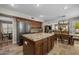 Open kitchen with island, stainless steel appliances and dining area at 9708 E Pampa Ave, Mesa, AZ 85212