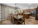 Kitchen featuring an island, view into the dining room and stainless appliances at 9708 E Pampa Ave, Mesa, AZ 85212