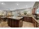 Open concept kitchen with island, sink and view of dining room at 9708 E Pampa Ave, Mesa, AZ 85212