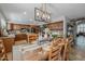 Open-concept dining area showcasing a chef's kitchen with granite countertops and stainless steel appliances at 9708 E Pampa Ave, Mesa, AZ 85212