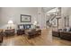 Spacious living room with a decorative staircase and wood flooring at 9708 E Pampa Ave, Mesa, AZ 85212