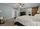 Bright main bedroom with en suite bathroom featuring sliding barn door entry and large dresser at 9708 E Pampa Ave, Mesa, AZ 85212