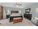 Main bedroom with a dark wood bedroom set, soft carpet, and natural light at 9708 E Pampa Ave, Mesa, AZ 85212