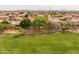 A neighborhood view showing houses and green space at 9708 E Pampa Ave, Mesa, AZ 85212