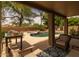 Outdoor patio with comfortable seating, table, and scenic view of the pool at 9708 E Pampa Ave, Mesa, AZ 85212
