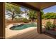 A beautifully designed backyard with pool, spa, and a rock waterfall feature at 9708 E Pampa Ave, Mesa, AZ 85212