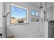 Bright shower with custom tile work, dual shower heads and a large window to the exterior at 9708 E Pampa Ave, Mesa, AZ 85212