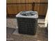 AC unit features on concrete platform with decorative gravel surrounding the unit at 10951 N 91St Ave # 255, Peoria, AZ 85345